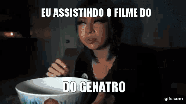 a woman with blue hair is sitting at a table with a bowl of food and the words eu assistindo o filme do do genaro