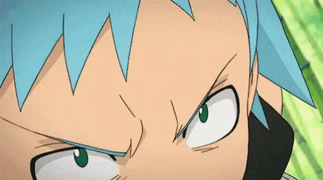 a close up of a person 's face with a serious look on their face .