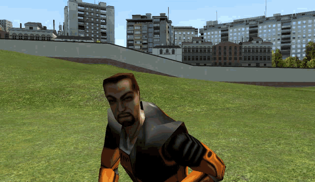 a man in an orange and black suit stands in a field with buildings in the background