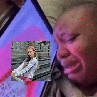a woman is crying while looking at a phone screen