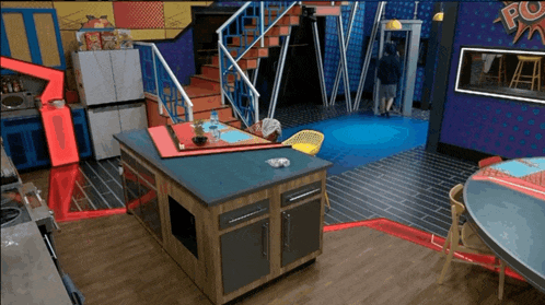 a kitchen with stairs and a sign that says pop