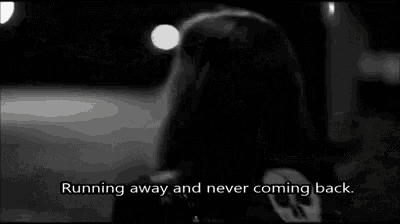 a black and white photo of a person running away and never coming back