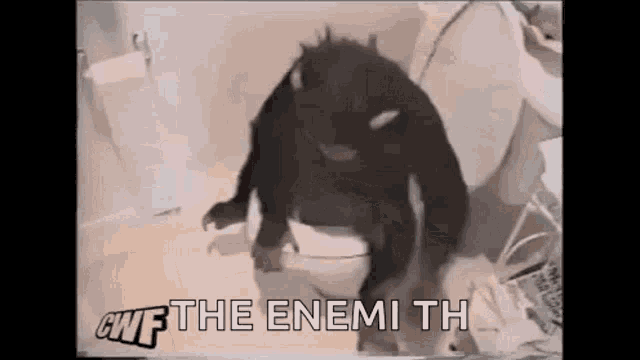 a black monster is sitting on a toilet with the words `` give the enemy th '' .