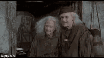 a man and a woman are sitting next to each other and saying `` bye bye ! ''