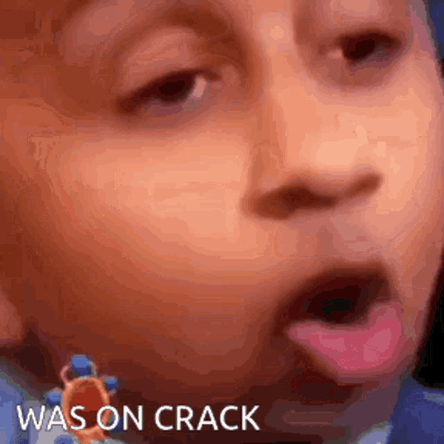 a close up of a child 's face with the words was on crack written below it