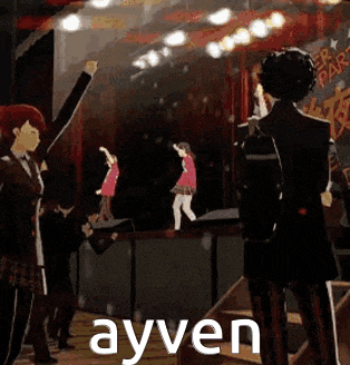 a group of people are standing on a stage with their arms in the air and the word ayven in the corner .