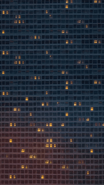 a building with a lot of windows that are lit up