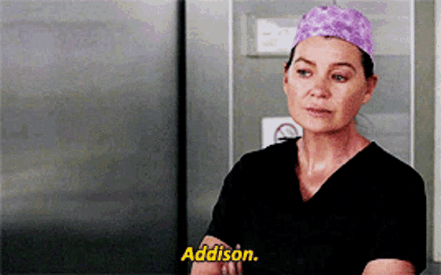 a woman in scrubs is talking to addison