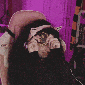 a woman wearing headphones and a chair that says lx