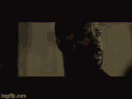 a blurry picture of a man talking on a cell phone with the website imgflip.com in the corner