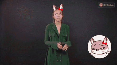 a woman wearing bunny ears is shrugging her shoulders next to a cartoon of a rabbit