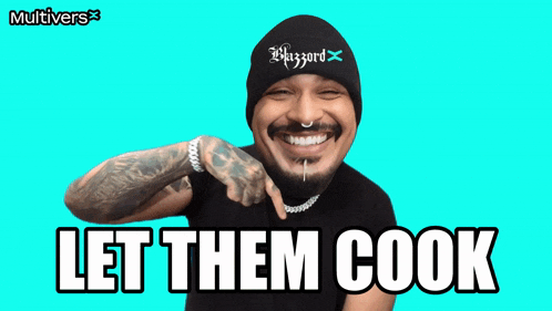 a man wearing a beanie with the word blizzard on it says let them cook