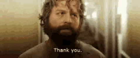 a man with a beard is saying thank you in a bathroom .