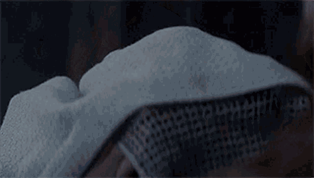 a close up of a person 's head with a bandage covering it .