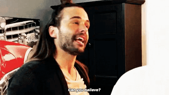 a man with long hair and a beard is asking if he can believe