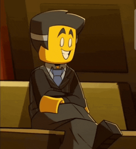 a lego man in a suit and tie is smiling