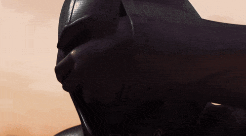 a close up of a person wearing a black hood