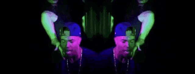 a man and a woman are standing next to each other in a dark room with glowing lights .