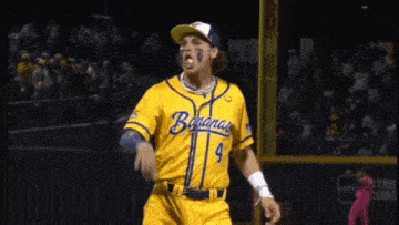 a baseball player wearing a yellow uniform with the word bananas on it