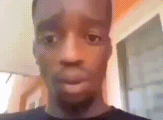 a close up of a man 's face with a blurred background