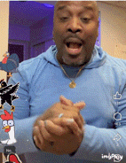 a man wearing a blue hoodie is clapping his hands in a video
