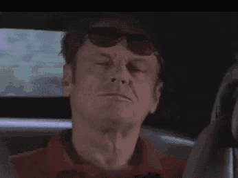 a man wearing sunglasses says " deal with it " while driving a car