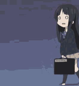 a girl in a school uniform is standing next to a black box