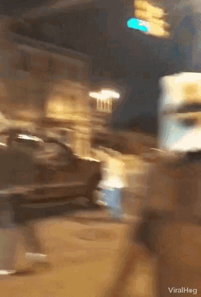 a blurry picture of a street with the words viralhog on the bottom right