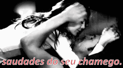 a black and white photo of a man and a woman with the words saudades do seu chamego written below them