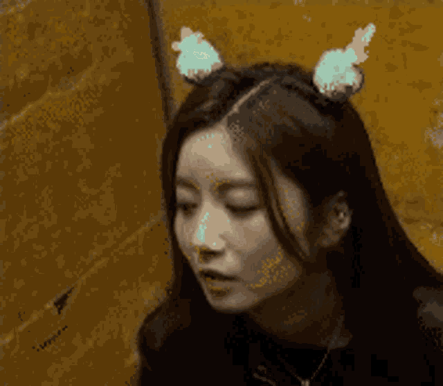 a woman wearing bunny ears on her head