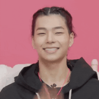 a woman covering her face with a red lip drawing