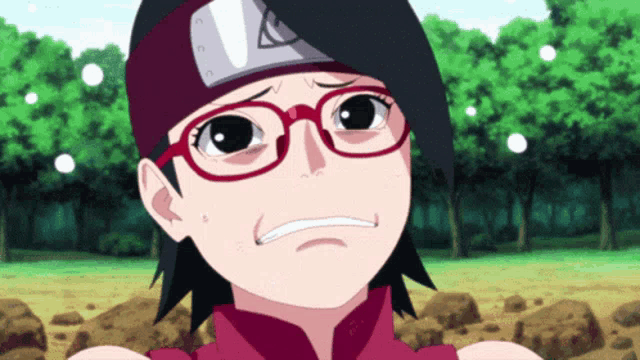 a girl wearing glasses and a headband with an arrow on it