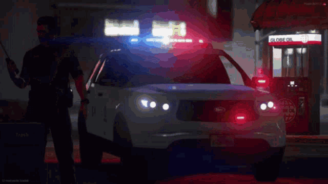 a man is talking on a cell phone in front of a police car