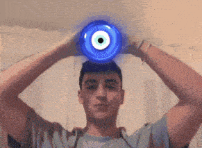 a man with a blue evil eye on his head
