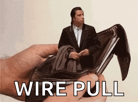 a man in a suit is being pulled out of an empty wallet with the words `` wire pull '' written on it .