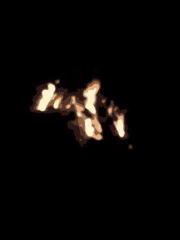 a fire burns brightly in the dark with a black background