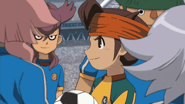 a group of anime characters are standing around a soccer ball and one of them has the letter s on his shirt