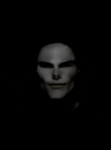 a close up of a man 's face with a black background