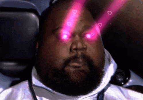 a man with hearts coming out of his eyes and a beard