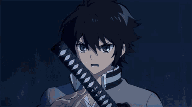 a blue light is shining on a person in the dark