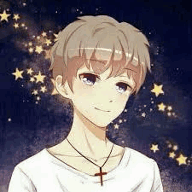 a boy wearing a cross necklace and a white shirt is smiling .