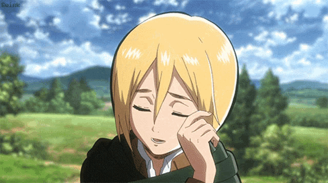 a girl with blonde hair and a scarf around her neck is crying with her eyes closed
