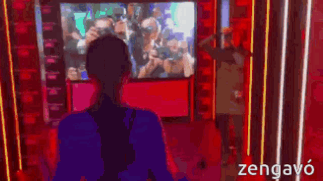 a pixelated image of a woman looking out a window with the word zengavo on the bottom right