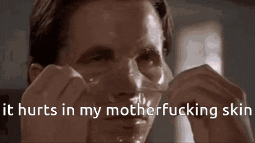 a close up of a man 's face with the words " it hurts in my motherfucking skin " above him