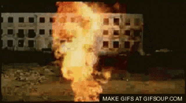 a picture of a building on fire with the words make gifs at gifsoup.com below it