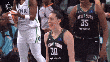 a female basketball player wearing a jersey with the number 30