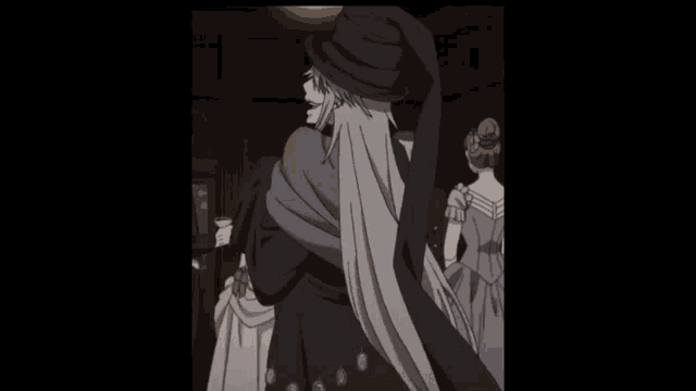 a man in a black hat is standing in a room