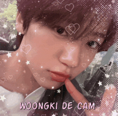 a close up of a person 's face with the name woongki de cam