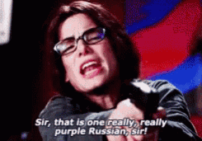 a woman wearing glasses is holding a gun and says sir that is one really really purple russian sir