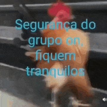 a man in a red hat is walking in front of a sign that says segurança do grupo on .